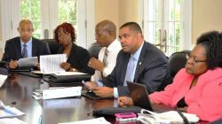Gov. John deJongh Jr. and his financial team meeting with bond rating agencies (Government House photo). Gov. John deJongh Jr. and his financial team meeting with bond rating agencies (Government House photo).